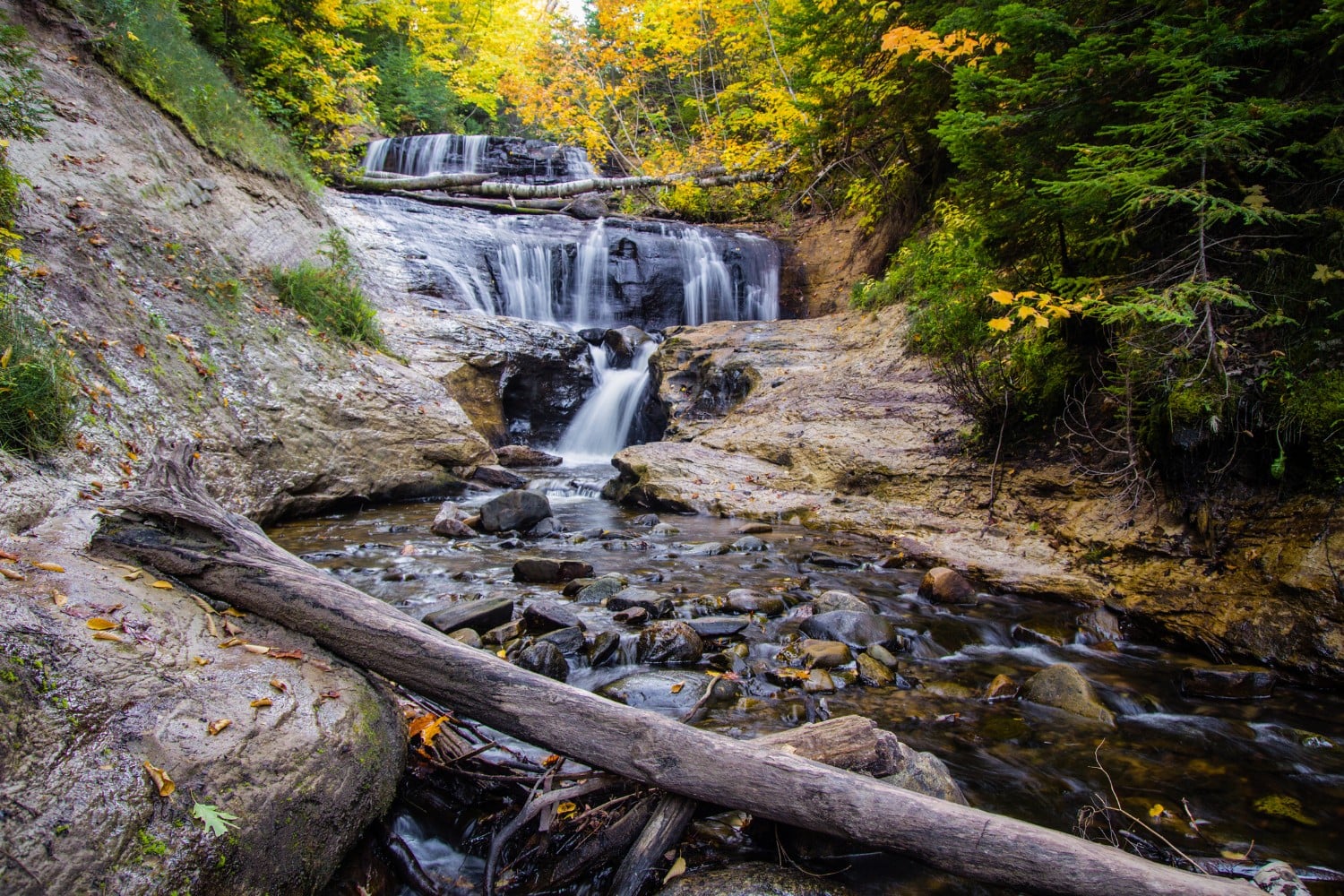 autumn waterfall in michigan near pictured rocks national lakeshore